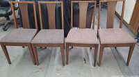 Four vintage Hepworth dining chairs shown side by side, two with dark seat fabric and two with light seat fabric, all wooden frames.