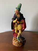 Front view of Royal Doulton The Pied Piper figurine showing detailed color and pose.