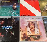 Photo of 6 vinyl record albums including David Lee Roth, Van Halen's Diver Down and 1984, Anna Murray, and one partially visible album.