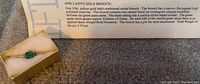 Vintage 10kt gold ladies brooch in gold box with description card showing details of the brooch