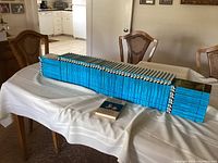 58 Hardy Boys Mystery Stories volumes lined up on table under dust jackets