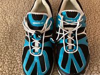 Top view of the blue and black Speedo Hydro Comfort water shoes showing the elastic laces with toggle and cushioned white inner lining.