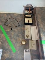 Complete lot showing jewelry pieces and jewelry box on surface