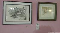 Both framed prints hanging on a wall side by side, showing the house print on left and Winter Birch print on right.