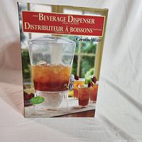 Front view of CreativeWare Beverage Dispenser box showing 3 gallon capacity and iced beverage inside dispenser.