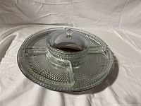 Top view of the lazy Susan with all glass dishes in place and chrome lid on center dish.