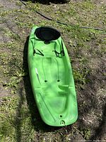 Top-down view of green Pelican Solo kayak showing seat and footrests.