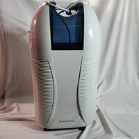 Front view of the white Simplicity portable dehumidifier showing the water tank and vents.