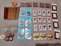 Top view of the make-up items laid out on a grey fabric surface showing all products in photo lstimg_01j8xbvt4afj2rtksv3sqybm25