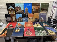 Full set of 21 hardcover books from Newsweek's Wonders of Man series arranged on a table showing colorful photographic dust jackets with various historic landmarks.