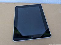 Front view of the iPad showing the screen and home button