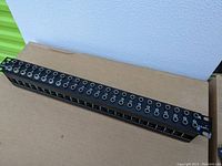 Front view of Neutrik TRS patch bay with all jacks visible