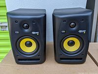 Front view of two KRK Rokit 5 powered studio monitors side by side