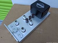 Top view showing silver aluminum chassis, empty tube sockets and electrolytic capacitors