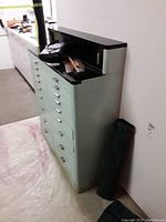 Front perspective view showing full cabinet against wall