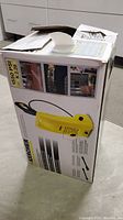 Box of Karcher power washer model K2.28 with 1550 PSI rating, showing product image and specifications.