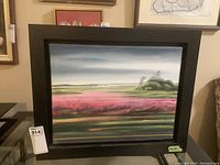 Full view of framed painting mounted on wall