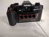 Front view of Nishika N8000 3-D Camera showing four lenses and branding