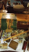 Photo showing full lot including teapot with cozy, porcelain cheese dish, salt and pepper shakers, wooden trays, and 1946 calendar.