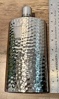Top-down view of the vintage chrome hip flask with a ruler showing approximately 7.5 inches in height, hammer-textured surface, and rectangular shape.
