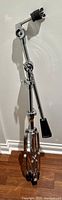 Full view of vintage Pearl boom cymbal stand showing tripod base and boom arm.