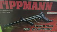 Box front showing Tippmann 98 Custom paintball marker image and branding.
