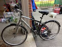 Side view of silver Westwood KHS multi-speed bicycle showing frame, fork, fenders, drivetrain and rear wheel