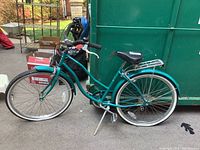 Full side view of teal step-through Cromolite cruiser bicycle