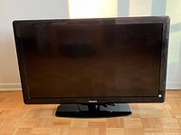 Front view of the 42 inch Philips LCD TV showing the screen and stand.