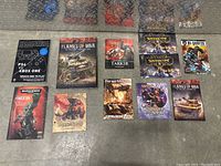 Full collection of game guides and catalogues laid out on the floor