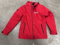 Front view of red Nintendo jacket with zippered pockets and white Nintendo logo on chest.