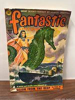 Front cover of the Fantastic Adventures magazine, May 1951 issue, showing a large green seahorse, a woman with a spear, and a ship under a cloudy sky.