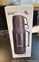 Box front showing beverage bottle and 24 hour hot or cold temperature retention icons.