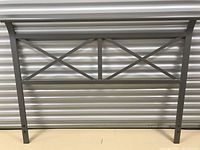 Silver/grey metal queen size headboard with cross bar design and adjustable mounting holes on vertical sides.
