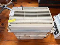 Front view of the Kenmore window air conditioner showing vent slats and power cord.