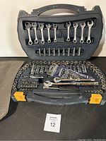 Full case open showing all tools including wrenches, sockets, ratchets and bits.