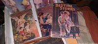 Five vintage Bedtime Stories magazines displayed, showing graphic colorful covers with children playing and pastoral scenes, 8x6 inches.