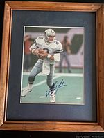 Front view of the framed photo featuring Troy Aikman in mid-action pose with autograph visible.