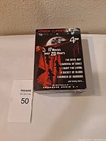 Front view of DVD multi-pack box showing artwork and list of featured movies including The Devil Bat, Carnival of Souls, I Bury the Living, A Bucket of Blood, Chamber of Horrors
