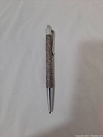 Full length view of the sterling silver and enamel pen on white background.