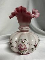 Front view of vase showing ruffled top and hand-painted rose motif