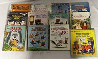 Photo showing the complete set of 13 assorted Little Golden Books with illustrated covers featuring animals and classic characters.