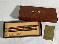 Complete pen and pencil set in original Bradley box with instruction booklet.