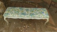 Top view of the floral fabric bench showing length and fabric pattern.