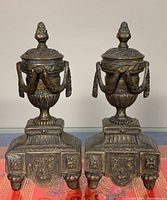 Both andirons side by side front view