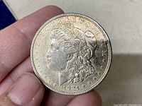 Obverse side showing Lady Liberty head with 1921 date and E PLURIBUS UNUM inscription.