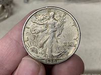 Obverse side of 1934 Walking Liberty half dollar showing Lady Liberty, date, and inscriptions.