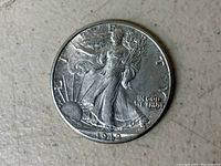 Obverse side of the 1942 Walking Liberty Half Dollar coin showing Lady Liberty, date, and inscriptions.