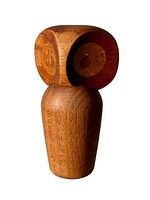 Front and side view of a carved teak owl figurine with articulated swiveling head, showing concentric eye carvings and smooth finish.