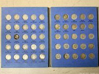 Two-panel blue folder displaying all 54 Roosevelt dimes with printed dates and mintages